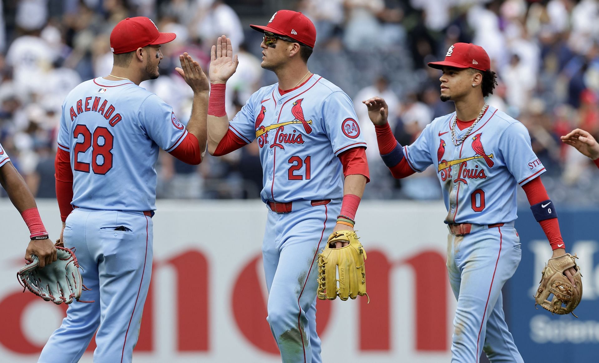 Nolan Arenado celebrates a win with Lars Nootbaar and Masyn Winn - Source: Getty